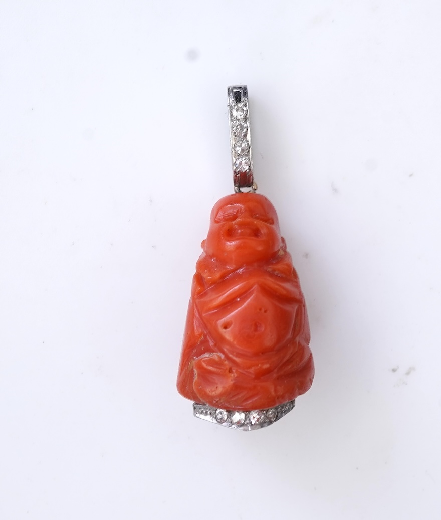 An Art Deco carved coral and diamond pendant, 1920s